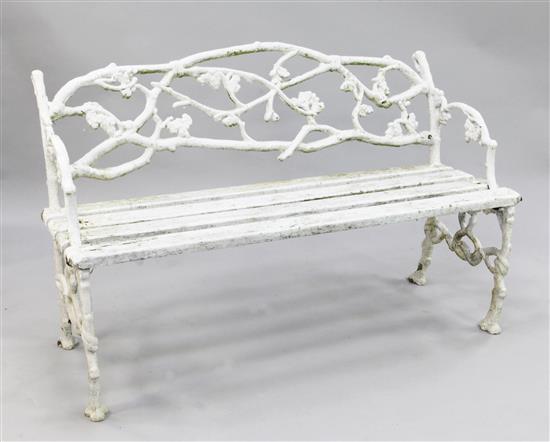 A Victorian rustic white painted cast iron garden bench, W.4ft 4in.